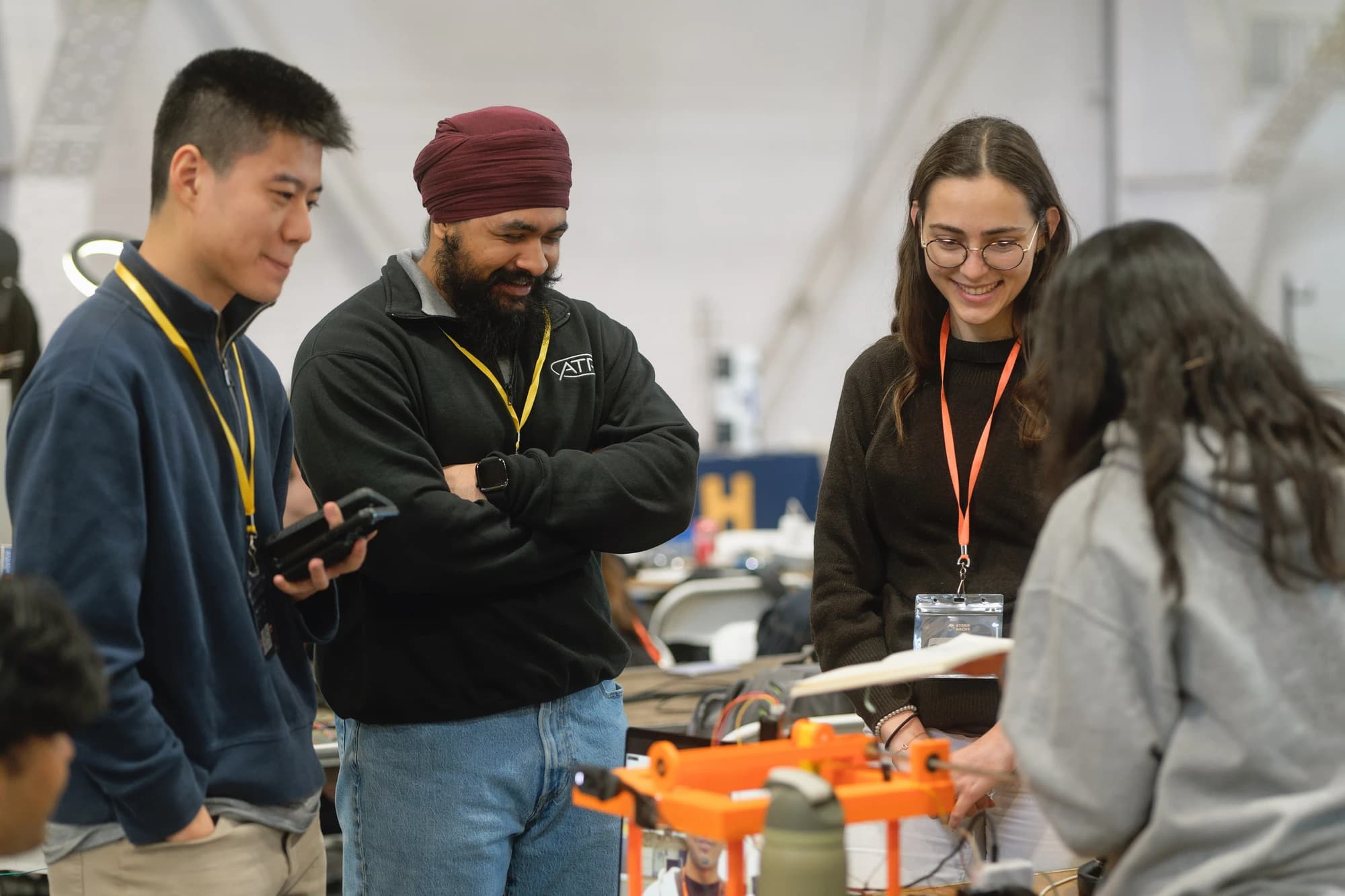 StarkHacks participants discussing a working hardware prototype